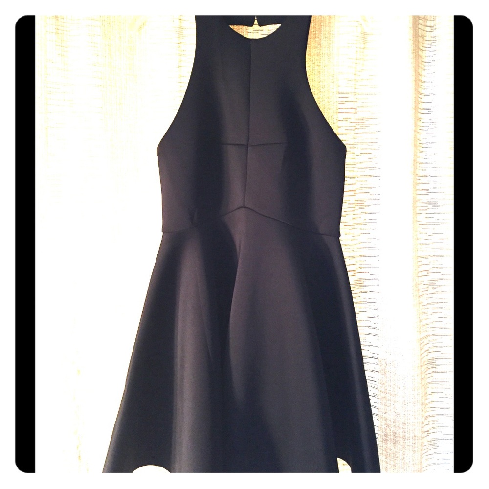 NWOT Beautiful black dress with great back design.